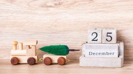 object Christmas decoration design with shopping cart and miniature worker isolated on white background.の写真素材
