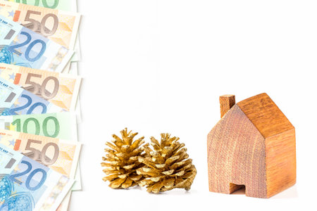 wood house with miniature people  isolated on white background.の写真素材