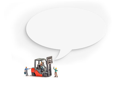 miniature people with forklift and blank speech bubble on white backgroundの写真素材