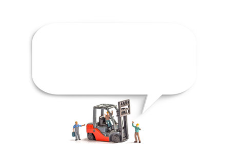 miniature people working with forklift and blank speech bubble on white backgroundの写真素材