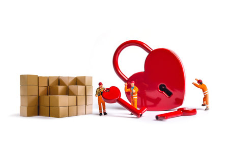 Miniature people : Worker team building a heart shape with box on white backgroundの写真素材