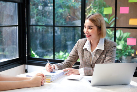 Businesswoman working with document on desk in office. Business concept.の写真素材