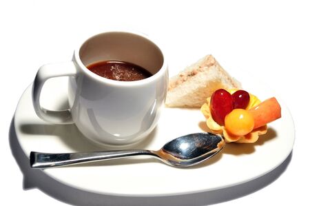 Cake with fresh fruits and coffeeの写真素材