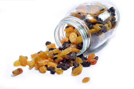 Raisins on the white background 