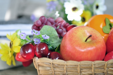 Fruits  Various fresh ripe fruits arranged in a wicker baskeの写真素材