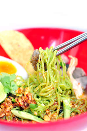 Thai noodle   in a bowl on a white background taste spicy noodle  .の写真素材