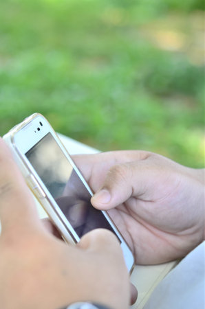 Close up of a woman using mobile smart phone