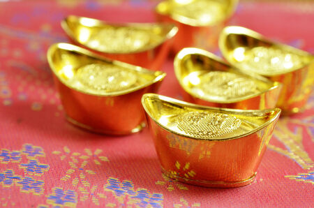 Chinese new year and gold ingotsの写真素材