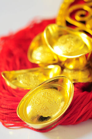 Chinese new year and gold ingotsの写真素材