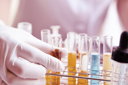 dropping liquid to test tubesの写真素材