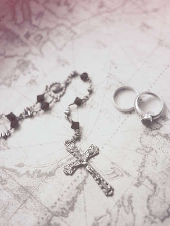 cross and ring on the mapの写真素材
