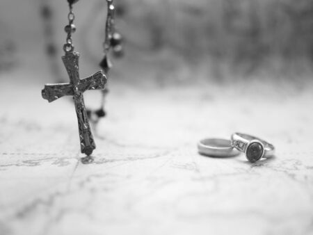 rosary and ring on mapの写真素材