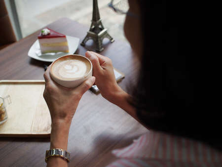 woman hold cup coffee in handの写真素材