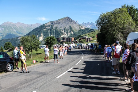 La Toussuire, France - 12 july 2012 - Road where the Tour the France riders will come, in the back the village of Corbier のeditorial素材