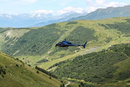 Col de la Madeleine, France - July 12, 2012 - French TV helicopter flying to film Tour de France 2012のeditorial素材
