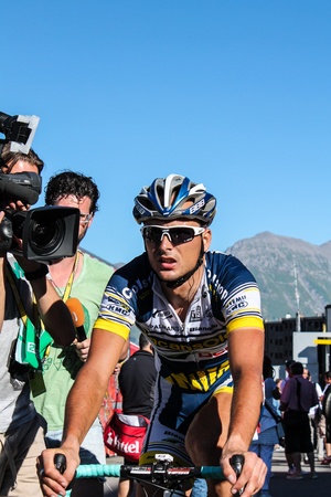 La Toussuire, France - July 13, 2012 - Johnny Hoogerland after the finish of stage 11 followed by Dutch press at Tour de France 2012のeditorial素材
