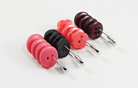 Collection of various sewing buttons on white backgroundの写真素材