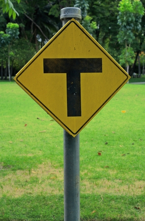 yellow road signs, traffic signs on nature backgroundの写真素材