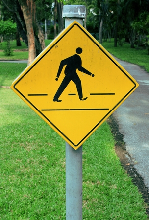 yellow road signs, traffic signs on nature backgroundの写真素材
