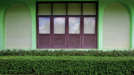 building has a window and the tree decorate