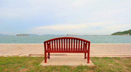 Wooden chairs on the beachfrontの写真素材