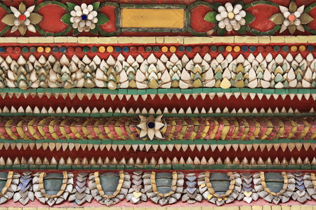 Colorful vintage ceramic tiles wall decoration at Temple of the Emerald Buddha or Wat Phra Kaew at Bangkok, Thailandの写真素材