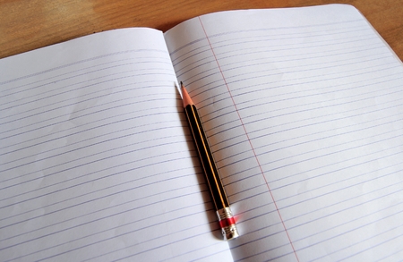 pencil lying on a blank paper, Creative work, writing, drawing etc.の写真素材