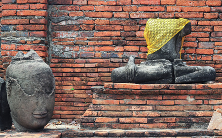 AYUTTHAYA-THAILAND : 9 August 2015 Buddha statue and stupa at Wat Mahathat. Ayutthaya A temple in Ayutthaya historical park. Wat Mahathat temple is of paramount importance in Ayutthaya.のeditorial素材