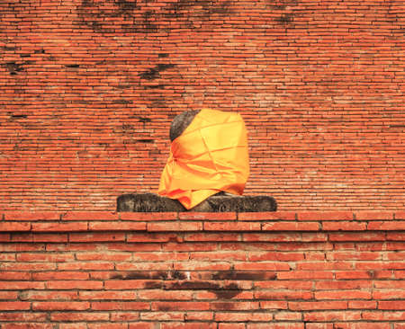 AYUTTHAYA-THAILAND : 9 August 2015 Buddha statue and stupa at Wat Mahathat. Ayutthaya A temple in Ayutthaya historical park. Wat Mahathat temple is of paramount importance in Ayutthaya.のeditorial素材
