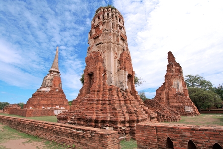 AYUTTHAYA-THAILAND : 9 August 2015 Buddha statue and stupa at Wat Mahathat. Ayutthaya A temple in Ayutthaya historical park. Wat Mahathat temple is of paramount importance in Ayutthaya.のeditorial素材