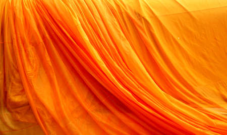 Gold silk fabric background - soft, elegant and delicate for the Buddha.の写真素材