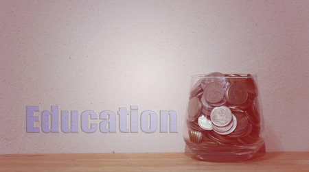 Money in the glass , financial concept , Vintage tone soft focus old walls backgroundの写真素材