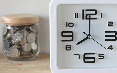 The concept of saving money with a clock foreground
