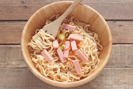wood bowl of noodles with pork ( BOLOGNA) on wooden tableの写真素材