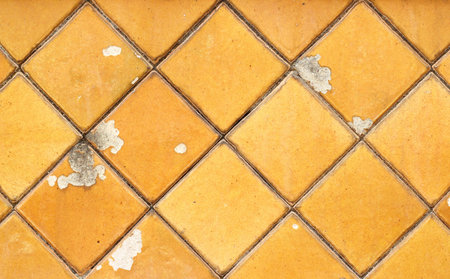Old Yellow tiles wall textured background