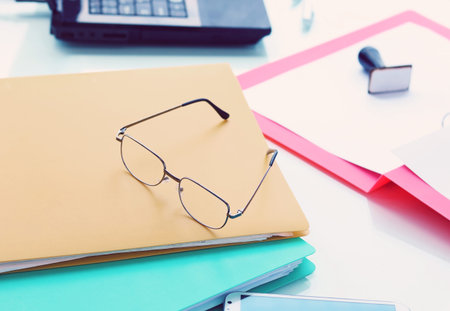 Office desk , ( Focus on glasses )