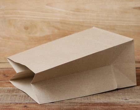 paper bag on wooden backgroundの写真素材
