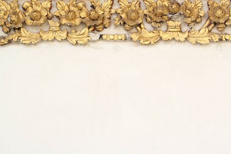 pattern gold flower of stucco design of native thai style on the wallの写真素材