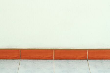 Cement wall and Wooden skirting boards , vintage toneの写真素材