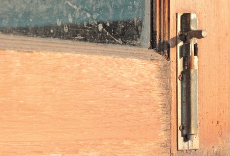 close-up old wooden window with Antique Iron window latchの写真素材