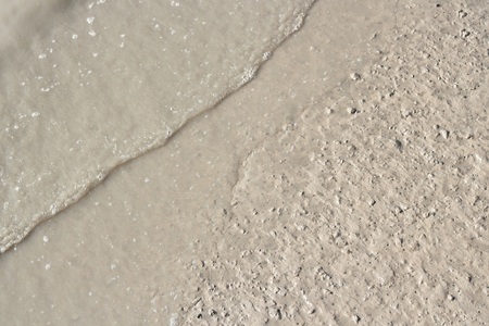 Mud texture or wet brown soil as natural organic clay and geological sediment mixtureの写真素材