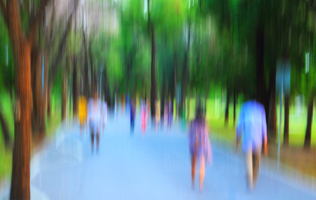 blurred people lifestyle at public park in the eveningの写真素材