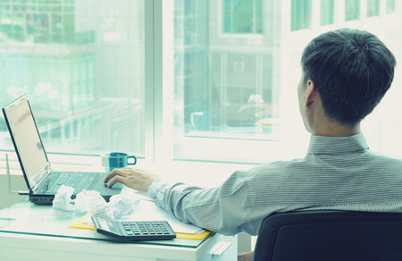 Business Man working in office and using notebook computer, man's hands using notebook computer in officeの写真素材
