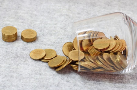 money in the glass on soft textureの写真素材