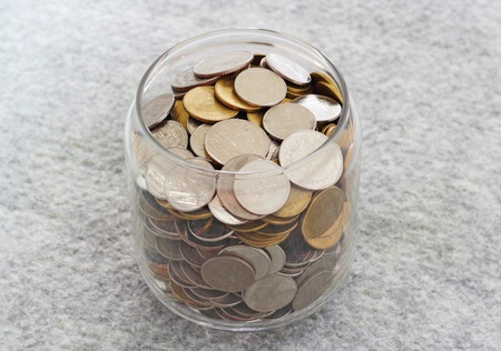 money in the glass on soft textureの写真素材