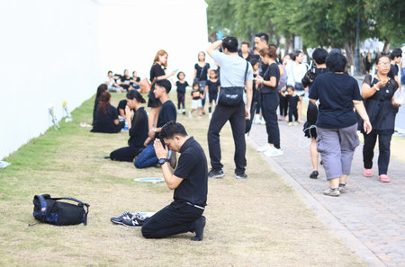Bangkok, Thailand -OCT 23 2016: A crowd of mourners at Sanam Luang, while the body of Thailand Bhumibol Adulyadej is taken from the hospital to the Temple of the Emerald Buddha in Bangkok.のeditorial素材