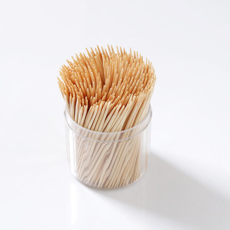 Toothpicks in a box on white background