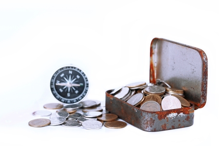 Coins in box isolated on white, Save for Travel conceptの写真素材