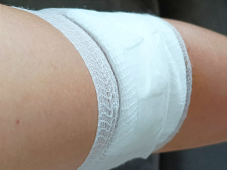 Bandage on the knee of a young woman, close-upの写真素材