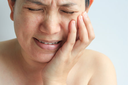 Face of woman with toothache, health conceptの写真素材